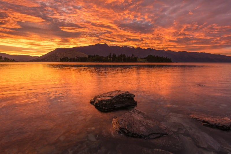A special summertime sunrise behind the Remarkables Mountain range. Taken overlooking Frankton Arm, Lake Wakatipu, Queenstown.