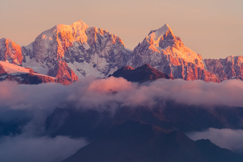 As the sun falls the last light falls on the peaks of the two tallest mountains in New Zealand, Aoraki/Mt Cook and Mt Tasman. Taken from the Okarito Trig, West Coast.