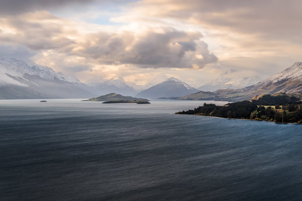 A long exposure capture of the strong winds pushing waves up the lake. Looking towards Glenorchy at the head of Lake Wakatipu from Bennett's Bluff lookout.