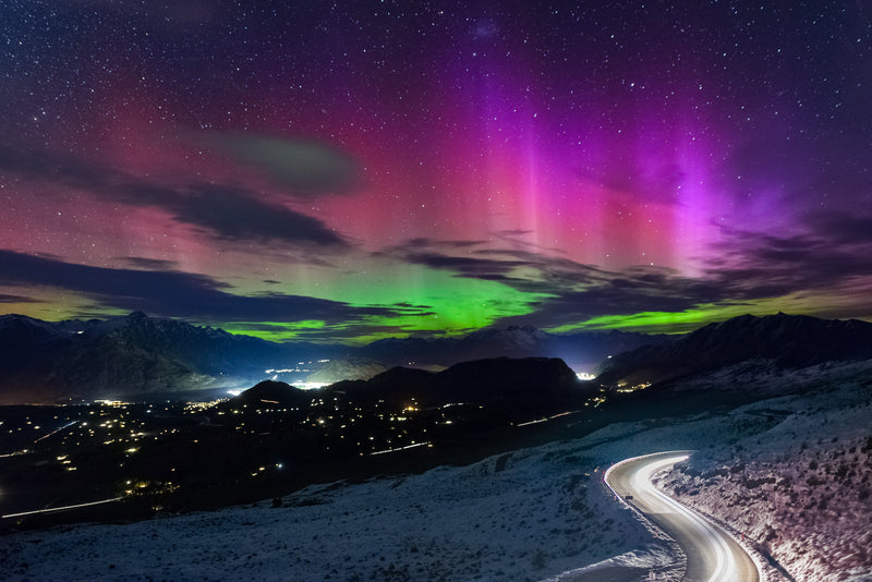 The Southern Lights light up the sky over Queenstown and the Wakatipu Basin. As viewed in mid autumn from the southern side of Coronet Peak.