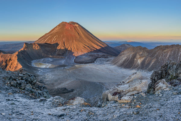 Looking down into the Southern Crater at Tongariro National Park one frosty winters morning. Mt Taranaki visible in the distance in the early morning light.